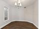 Cozy dining room with hardwood floors and a chandelier at 17307 Linda Vista Cir, Lutz, FL 33548