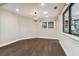 Bright dining room with dark hardwood floors and chandelier at 17307 Linda Vista Cir, Lutz, FL 33548