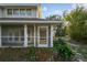 House exterior with a screened porch and brick walkway at 17307 Linda Vista Cir, Lutz, FL 33548