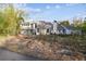 Two-story house with light gray siding, screened porch, and mature landscaping at 17307 Linda Vista Cir, Lutz, FL 33548
