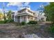 Two-story house with light gray siding, screened porch, and mature landscaping at 17307 Linda Vista Cir, Lutz, FL 33548