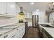 Updated kitchen with stainless steel appliances and white cabinetry at 17307 Linda Vista Cir, Lutz, FL 33548