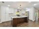 Modern kitchen featuring a large island and stainless steel appliances at 17307 Linda Vista Cir, Lutz, FL 33548