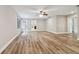 Expansive living area with wood-look floors and access to a patio at 17307 Linda Vista Cir, Lutz, FL 33548
