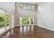 Bright living room featuring hardwood floors and sliding glass doors at 17307 Linda Vista Cir, Lutz, FL 33548