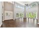 Spacious living room with high ceilings, hardwood floors, and lots of natural light at 17307 Linda Vista Cir, Lutz, FL 33548