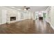 Open living room, hardwood floors, and kitchen view at 17307 Linda Vista Cir, Lutz, FL 33548