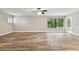 Spacious living room with wood-look floors and large windows at 17307 Linda Vista Cir, Lutz, FL 33548