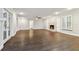 Spacious living room with hardwood floors, fireplace, and french doors at 17307 Linda Vista Cir, Lutz, FL 33548