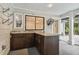 Outdoor kitchen with granite countertop and cabinets at 17307 Linda Vista Cir, Lutz, FL 33548
