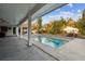 Covered patio overlooking a refreshing pool at 17307 Linda Vista Cir, Lutz, FL 33548