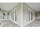 Screened porch with multiple French doors leading inside at 17307 Linda Vista Cir, Lutz, FL 33548