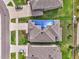 Aerial view of house with solar panels and neighborhood at 11321 Alachua Creek Ln, Riverview, FL 33579