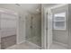 Bathroom with walk-in shower, toilet and double vanity at 11321 Alachua Creek Ln, Riverview, FL 33579