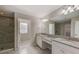 Elegant bathroom with double vanity and granite countertops at 11321 Alachua Creek Ln, Riverview, FL 33579