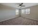 Bright bedroom with ceiling fan and carpet flooring at 11321 Alachua Creek Ln, Riverview, FL 33579