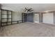 Large bonus room with built-in shelving and ceiling fan at 11321 Alachua Creek Ln, Riverview, FL 33579