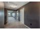 Upstairs hallway with carpet and access to bedrooms and bathroom at 11321 Alachua Creek Ln, Riverview, FL 33579