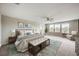 Main bedroom with large windows, carpet, and a ceiling fan at 11321 Alachua Creek Ln, Riverview, FL 33579