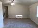 Bright living room featuring neutral walls and carpet at 6002 Christy Ln, Riverview, FL 33578