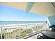 Balcony with seating area overlooking the beach and the ocean at 19440 Gulf Blvd # 201, Indian Shores, FL 33785