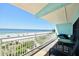 Balcony with seating area overlooking the beach and the ocean at 19440 Gulf Blvd # 201, Indian Shores, FL 33785