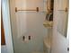 Small bathroom with toilet, sink, and built-in shelving at 3247 Kimberly Oaks Dr, Holiday, FL 34691