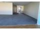 Open living room with a large doorway and blue carpeting at 6025 Shore S Blvd # 412, Gulfport, FL 33707