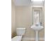 Small half bathroom with pedestal sink and toilet at 11516 Bellamar St, Temple Terrace, FL 33637