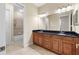 Double vanity bathroom with granite countertop at 11516 Bellamar St, Temple Terrace, FL 33637