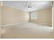 Spacious bedroom with ceiling fan and carpeting at 11516 Bellamar St, Temple Terrace, FL 33637