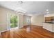 Bright dining room with hardwood floors and sliding doors to balcony at 11516 Bellamar St, Temple Terrace, FL 33637