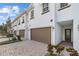 Townhouse exterior, brown garage door, and walkway at 11516 Bellamar St, Temple Terrace, FL 33637