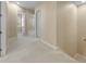 Upstairs hallway with carpet and access to bedrooms at 11516 Bellamar St, Temple Terrace, FL 33637