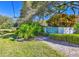 Eastwood Pines Townhomes entrance sign with lush landscaping at 1877 Pine Cone Cir, Clearwater, FL 33760