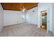 Bright bedroom with wood ceiling and carpet flooring at 5455 Lake Le Clare Rd, Lutz, FL 33558