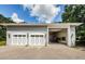 Spacious two-car garage with extra storage and large doors at 5455 Lake Le Clare Rd, Lutz, FL 33558