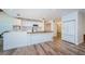 Modern kitchen with white cabinets and butcher block island at 5455 Lake Le Clare Rd, Lutz, FL 33558