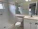 Bright bathroom with walk-in shower, toilet and vanity at 7656 Portstewart Dr, Lakewood Ranch, FL 34202