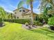 Well-maintained home exterior with a lush green lawn and manicured landscaping at 7656 Portstewart Dr, Lakewood Ranch, FL 34202