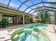 Enclosed pool with spa and brick surroundings, offering a relaxing outdoor space at 7656 Portstewart Dr, Lakewood Ranch, FL 34202