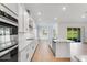 Modern kitchen with stainless steel appliances and white cabinets at 4638 Southern Valley Loop, Brooksville, FL 34601