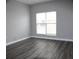 Bright bedroom with hardwood floors and large window at 2410 W Azeele St # 212, Tampa, FL 33609