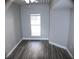 Bright bedroom with neutral walls and wood-look flooring at 2410 W Azeele St # 212, Tampa, FL 33609