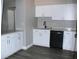 Modern kitchen with white cabinets and new appliances at 2410 W Azeele St # 212, Tampa, FL 33609