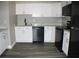 Modern kitchen with white cabinets and new appliances at 2410 W Azeele St # 212, Tampa, FL 33609