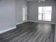 Spacious living room with hardwood floors and sliding door at 2410 W Azeele St # 212, Tampa, FL 33609