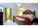 Large bedroom with a king-size bed and access to a walk-in closet at 6906 N Clark Ave, Tampa, FL 33614