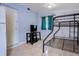 Small bedroom with a bunk bed, TV, and tiled floor at 6906 N Clark Ave, Tampa, FL 33614