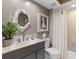 Updated bathroom with walk-in shower and modern vanity at 10823 Indian Hills Ct # 32, Seminole, FL 33777